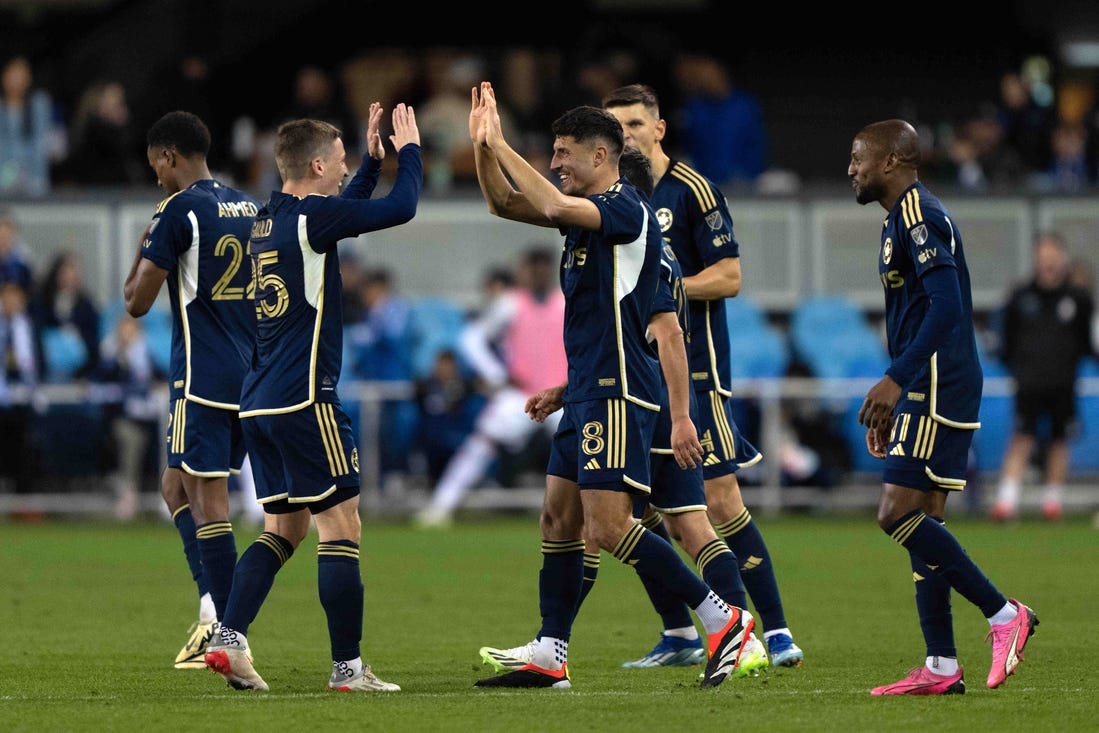 Mar 9, 2024; San Jose, California, USA; Vancouver Whitecaps FC midfielder Alessandro Schopf (8) celebrates with midfielder Ryan Gauld (25) after scoring a goal during the second half agains the San Jose Earthquakes at PayPal Park. Mandatory Credit: Stan Szeto-USA TODAY Sports