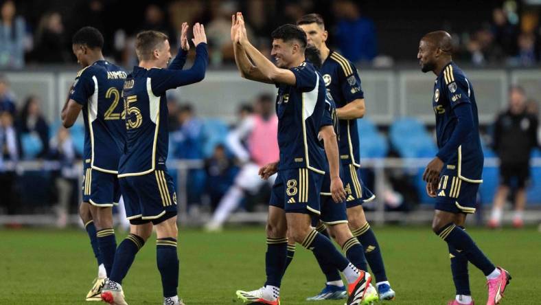 Mar 9, 2024; San Jose, California, USA; Vancouver Whitecaps FC midfielder Alessandro Schopf (8) celebrates with midfielder Ryan Gauld (25) after scoring a goal during the second half agains the San Jose Earthquakes at PayPal Park. Mandatory Credit: Stan Szeto-USA TODAY Sports