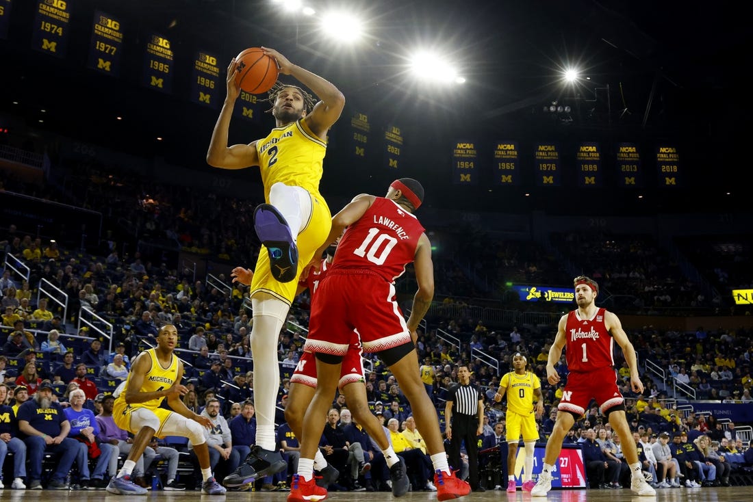 Mar 10, 2024; Ann Arbor, Michigan, USA;  Michigan Wolverines forward Tray Jackson (2) grabs the rebound over Nebraska Cornhuskers guard Jamarques Lawrence (10) in the first half at Crisler Center. Mandatory Credit: Rick Osentoski-USA TODAY Sports