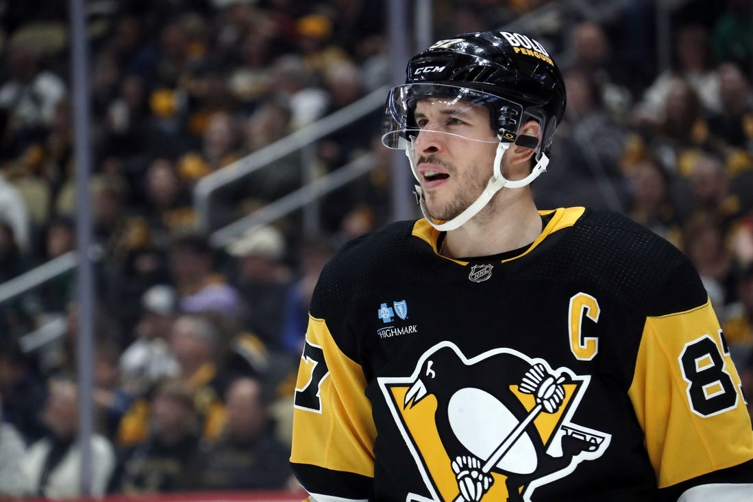 Mar 10, 2024; Pittsburgh, Pennsylvania, USA;  Pittsburgh Penguins center Sidney Crosby (87) looks on against the Edmonton Oilers during the second period at PPG Paints Arena. Mandatory Credit: Charles LeClaire-USA TODAY Sports