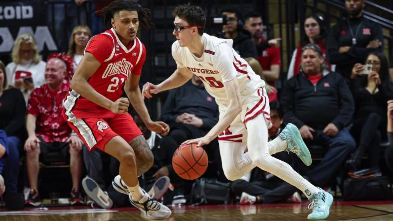 Mar 10, 2024; Piscataway, New Jersey, USA;Rutgers Scarlet Knights guard Gavin Griffiths (10) dribbles against Ohio State Buckeyes forward Devin Royal (21) during the first half at Jersey Mike's Arena. Mandatory Credit: Vincent Carchietta-USA TODAY Sports