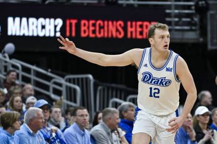 Mar 10, 2024; St. Louis, MO, USA;  Drake Bulldogs guard Tucker DeVries (12) reacts after making a three pointer against the Indiana State Sycamores during the first half of the Missouri Valley Conference Tournament Championship game at Enterprise Center. Mandatory Credit: Jeff Curry-USA TODAY Sports