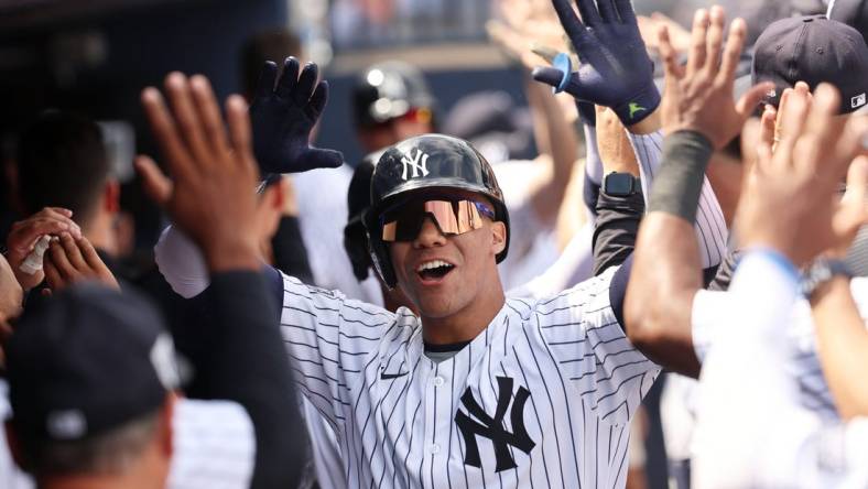 Mar 10, 2024; Tampa, Florida, USA;  New York Yankees left fielder Juan Soto (22) is congratulated after hitting a three run home run during the fourth inning  against the Atlanta Braves at George M. Steinbrenner Field. Mandatory Credit: Kim Klement Neitzel-USA TODAY Sports