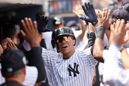 Mar 10, 2024; Tampa, Florida, USA;  New York Yankees left fielder Juan Soto (22) is congratulated after hitting a three run home run during the fourth inning  against the Atlanta Braves at George M. Steinbrenner Field. Mandatory Credit: Kim Klement Neitzel-USA TODAY Sports