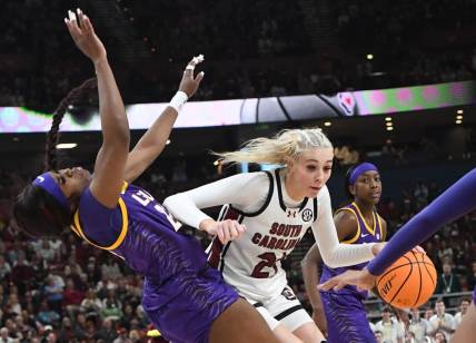 South Carolina guard Chloe Kitts (21) fouls Louisiana State University guard Aneesah Morrow (24) during the second quarter of the SEC Women's Basketball Tournament Championship game at the Bon Secours Wellness Arena in Greenville, S.C. Sunday, March 10, 2024.