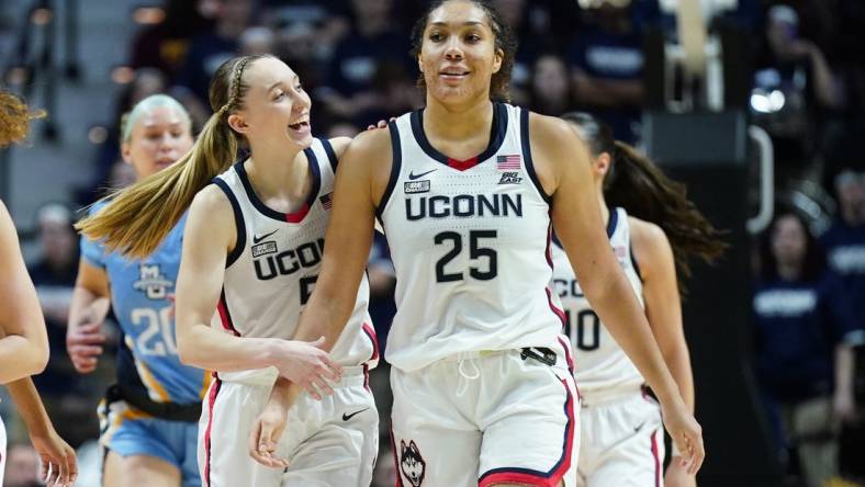 Mar 10, 2024; Uncasville, CT, USA; UConn Huskies guard Paige Bueckers (5) reacts with forward Ice Brady (25) after a play against the Marquette Golden Eagles in the second half at Mohegan Sun Arena. Mandatory Credit: David Butler II-USA TODAY Sports