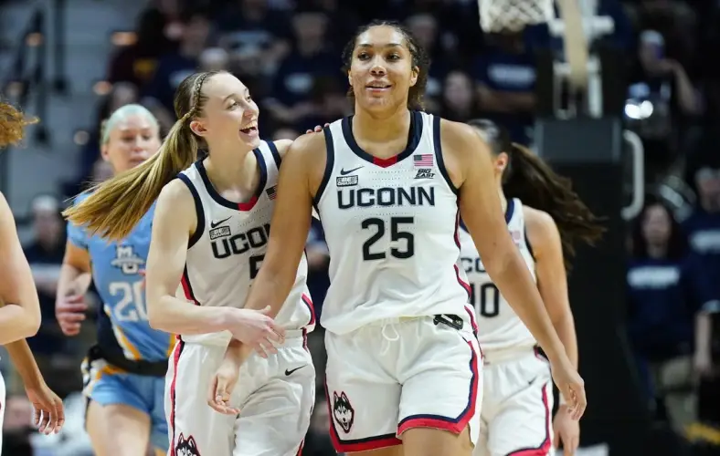 Mar 10, 2024; Uncasville, CT, USA; UConn Huskies guard Paige Bueckers (5) reacts with forward Ice Brady (25) after a play against the Marquette Golden Eagles in the second half at Mohegan Sun Arena. Mandatory Credit: David Butler II-USA TODAY Sports