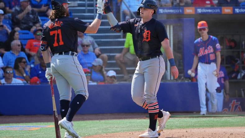 Mar 10, 2024; Port St. Lucie, Florida, USA;  Detroit Tigers second baseman Jace Jung (84) is congratulated by first baseman Ryan Vilade (71) for scoring a run in the eighth inning against the New York Mets at Clover Park. Mandatory Credit: Jim Rassol-USA TODAY Sports