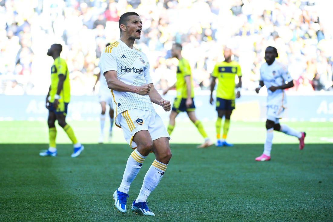 Mar 10, 2024; Nashville, Tennessee, USA; LA Galaxy forward Dejan Joveljic (9) celebrates scoring a goal against Nashville SC during the second half at Geodis Park. Mandatory Credit: Christopher Hanewinckel-USA TODAY Sports