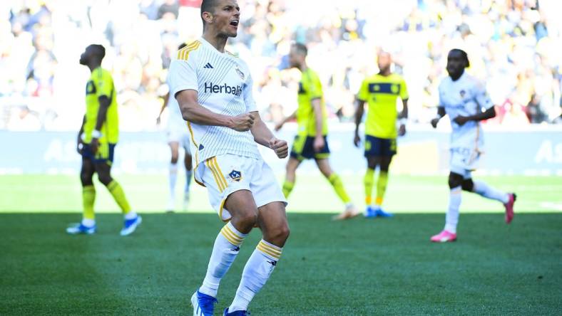 Mar 10, 2024; Nashville, Tennessee, USA; LA Galaxy forward Dejan Joveljic (9) celebrates scoring a goal against Nashville SC during the second half at Geodis Park. Mandatory Credit: Christopher Hanewinckel-USA TODAY Sports