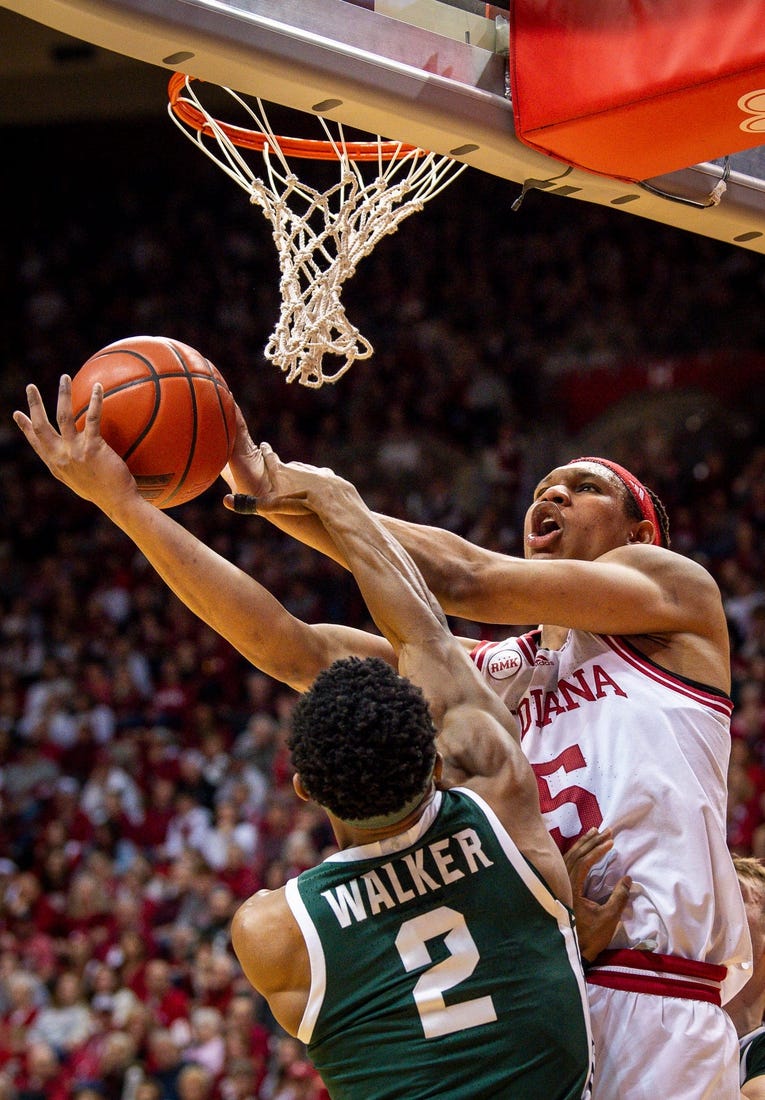 Indiana's Malik Reneau (5) is fouled by Michigan State's Tyson Walker (2) during the first half of the Indiana versus Michigan State men's basketball game at Simon Skjodt Assembly Hall on Sunday, March 10, 2024.