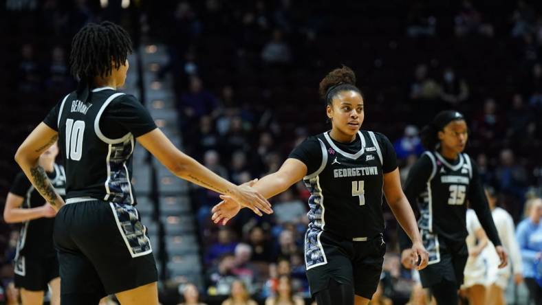 Mar 10, 2024; Uncasville, CT, USA; Georgetown Hoyas guard Alex Cowan (4) and forward Mya Bembry (10) react after a play in the first half at Mohegan Sun Arena. Mandatory Credit: David Butler II-USA TODAY Sports