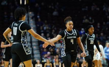 Mar 10, 2024; Uncasville, CT, USA; Georgetown Hoyas guard Alex Cowan (4) and forward Mya Bembry (10) react after a play in the first half at Mohegan Sun Arena. Mandatory Credit: David Butler II-USA TODAY Sports