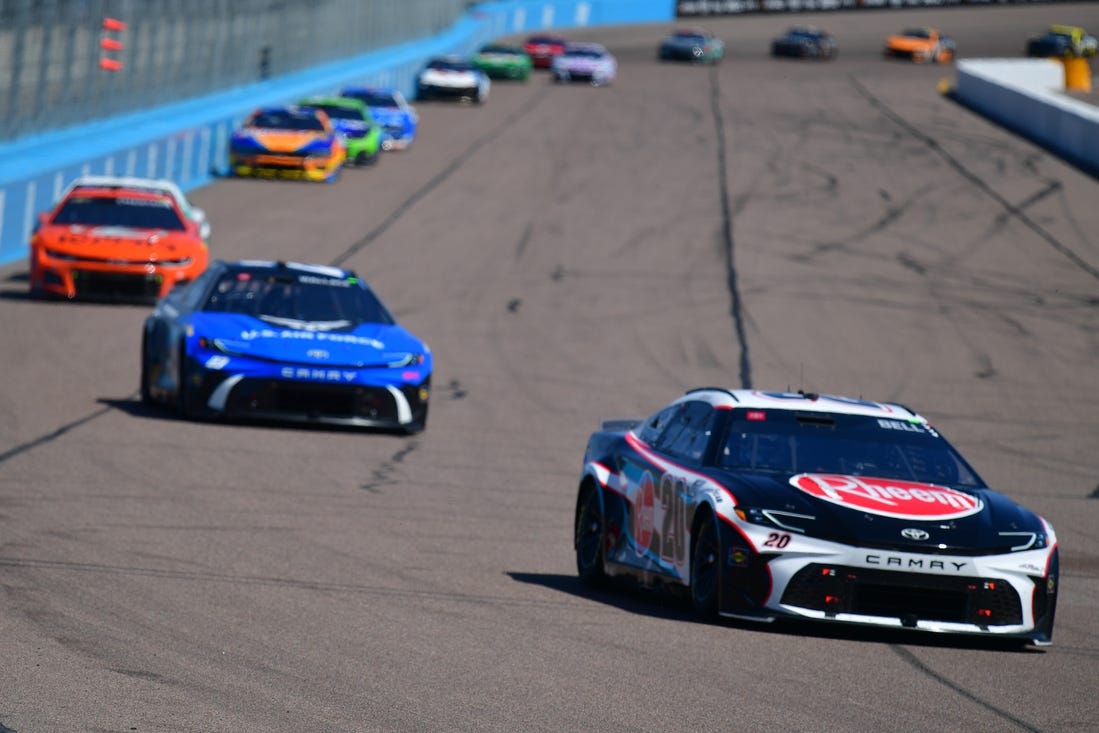 Mar 10, 2024; Avondale, Arizona, USA; NASCAR Cup Series driver Christopher Bell (20) leads a group during the Shriners Children’s 500 at Phoenix Raceway. Mandatory Credit: Gary A. Vasquez-USA TODAY Sports