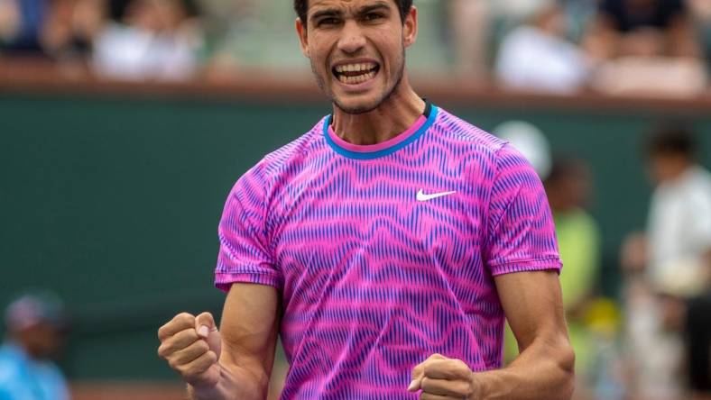 Carlos Alcaraz celebrates winning his match over Felix Auger-Aliassime during round three of the BNP Paribas Open in Indian Wells, Calif., Sunday, March 10, 2024.