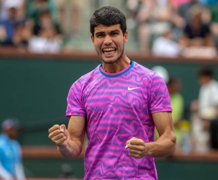 Carlos Alcaraz celebrates winning his match over Felix Auger-Aliassime during round three of the BNP Paribas Open in Indian Wells, Calif., Sunday, March 10, 2024.