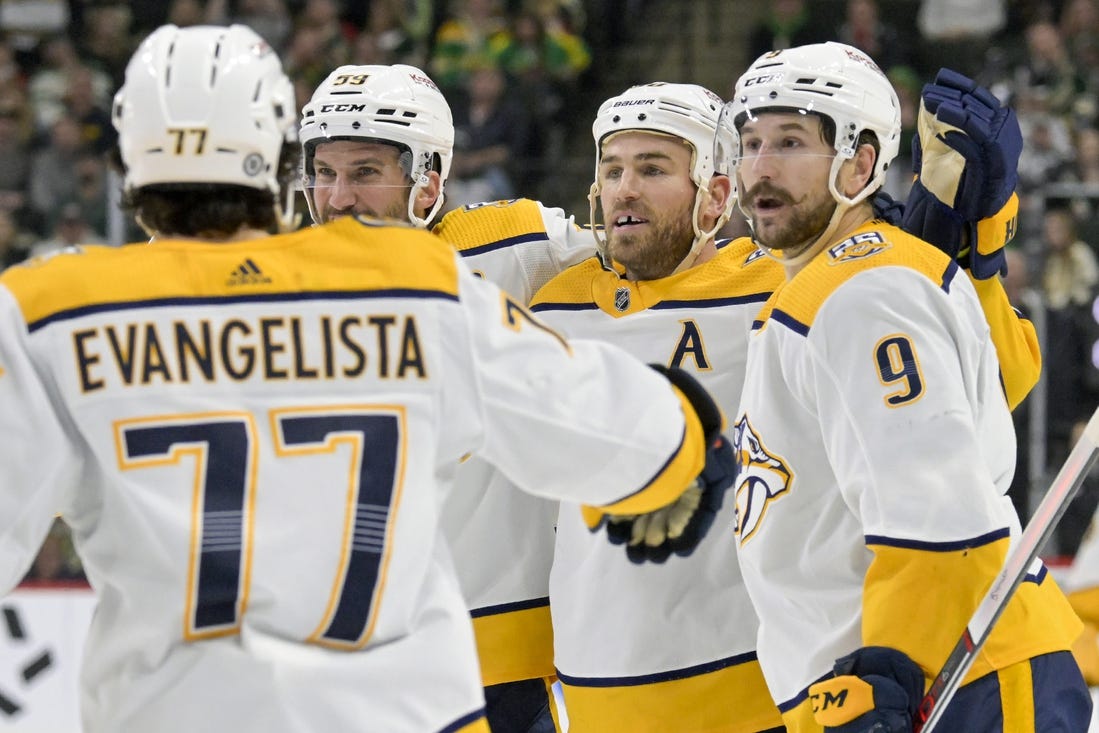 Mar 10, 2024; Saint Paul, Minnesota, USA;  Nashville Predators forward Ryan O'Reilly (90) celebrates his power play goal with defenseman Roman Josi (59) and forward Filip Forsberg (9) during the third period at Xcel Energy Center. Mandatory Credit: Nick Wosika-USA TODAY Sports