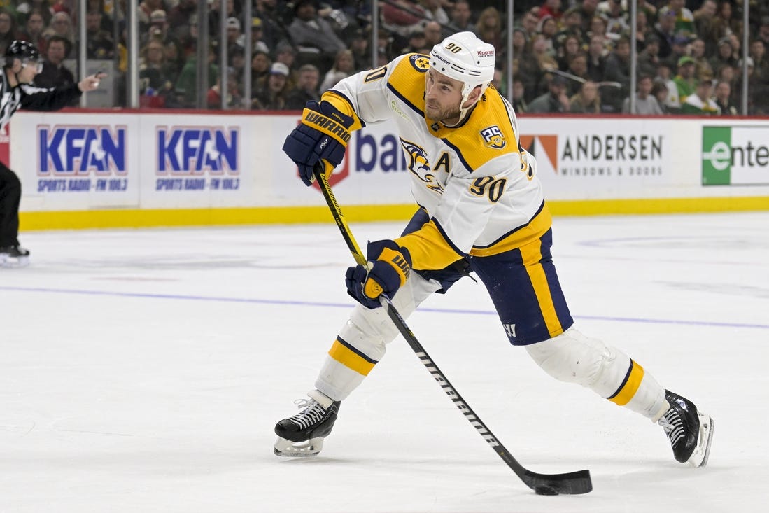 Mar 10, 2024; Saint Paul, Minnesota, USA;  Nashville Predators forward Ryan O'Reilly (90) scores a power play goal against the Minnesota Wild during the third period at Xcel Energy Center. Mandatory Credit: Nick Wosika-USA TODAY Sports