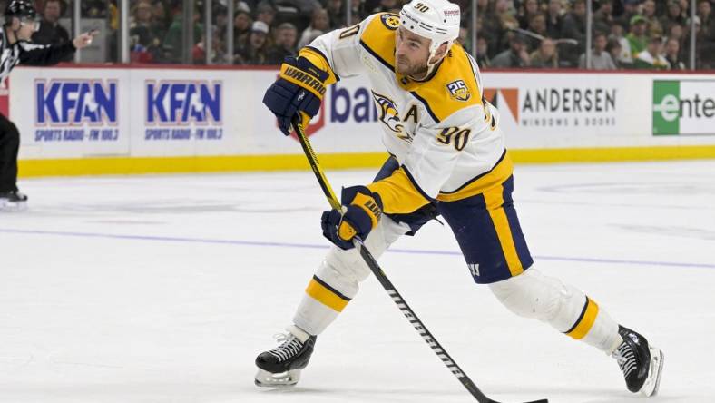 Mar 10, 2024; Saint Paul, Minnesota, USA;  Nashville Predators forward Ryan O'Reilly (90) scores a power play goal against the Minnesota Wild during the third period at Xcel Energy Center. Mandatory Credit: Nick Wosika-USA TODAY Sports