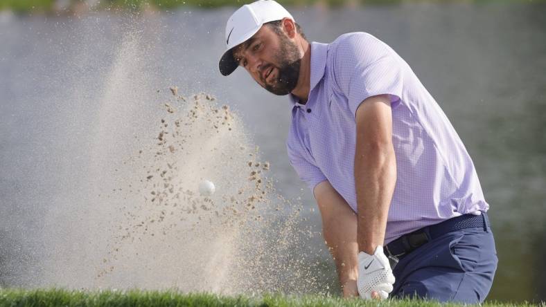 Mar 10, 2024; Orlando, Florida, USA;  Scottie Scheffler hits from the bunker on the 17th hole during the final round of the Arnold Palmer Invitational golf tournament. Mandatory Credit: Reinhold Matay-USA TODAY Sports