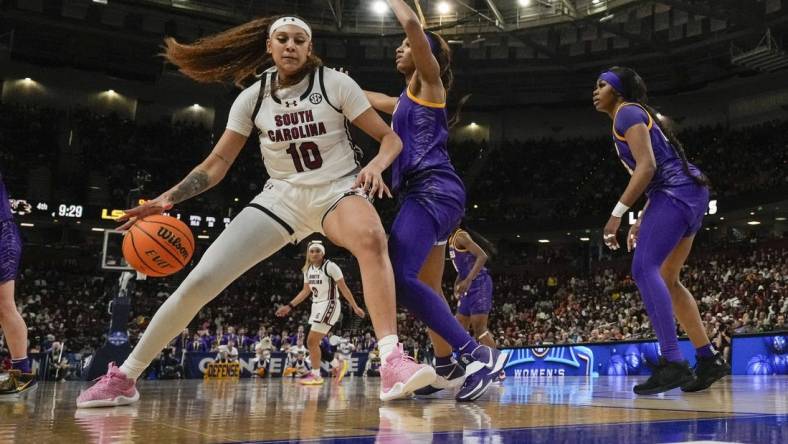 South Carolina Gamecocks center Kamilla Cardoso (10) works the ball toward the basket against LSU Lady Tigers forward Angel Reese (10) during the second half at Bon Secours Wellness Arena. Mandatory Credit: Jim Dedmon-USA TODAY Sports