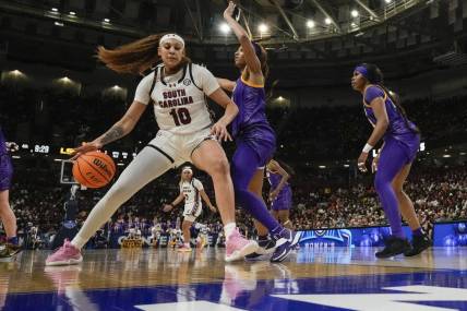 South Carolina Gamecocks center Kamilla Cardoso (10) works the ball toward the basket against LSU Lady Tigers forward Angel Reese (10) during the second half at Bon Secours Wellness Arena. Mandatory Credit: Jim Dedmon-USA TODAY Sports