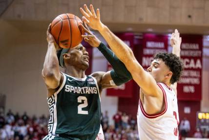 Mar 10, 2024; Bloomington, Indiana, USA; Michigan State Spartans guard Tyson Walker (2) shoots the ball while  Indiana Hoosiers guard Anthony Leal (3) defends in the second half at Simon Skjodt Assembly Hall. Mandatory Credit: Trevor Ruszkowski-USA TODAY Sports