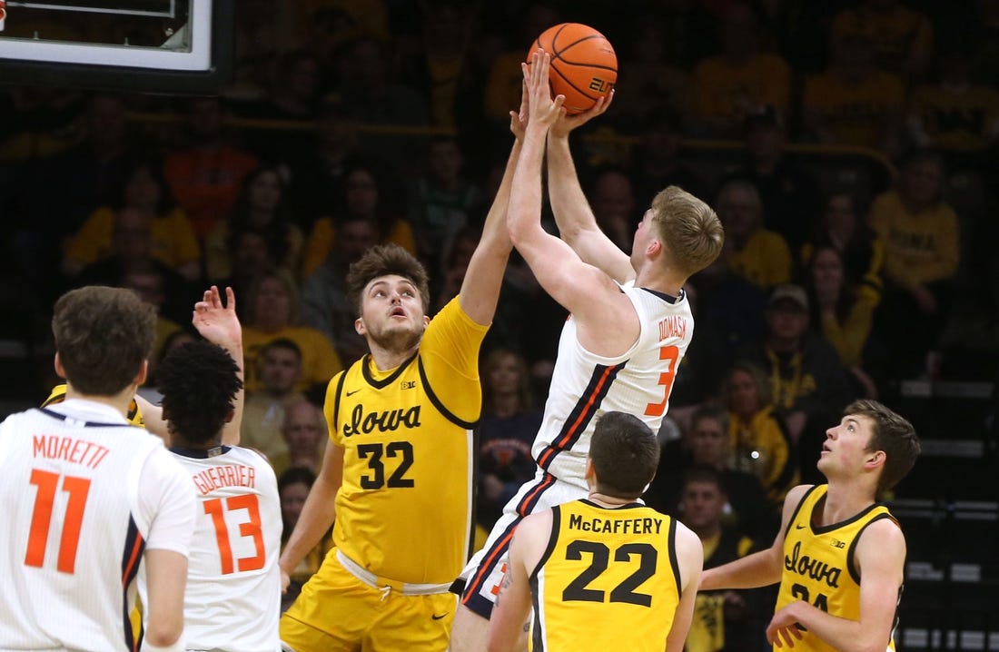 Iowa   s Owen Freeman (32) blocks Illinois    Marcus Domask (3) Sunday, March 10, 2024 at Carver-Hawkeye Arena in Iowa City, Iowa.