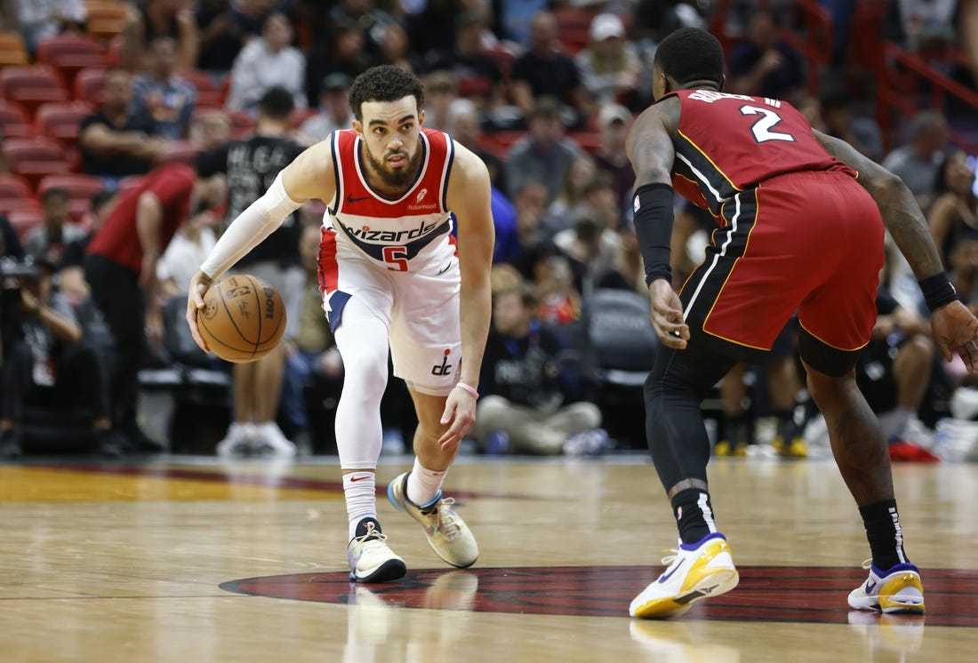 Mar 10, 2024; Miami, Florida, USA; Miami Heat guard Terry Rozier (2) defends Washington Wizards guard Tyus Jones (5) during the second half at Kaseya Center. Mandatory Credit: Rhona Wise-USA TODAY Sports