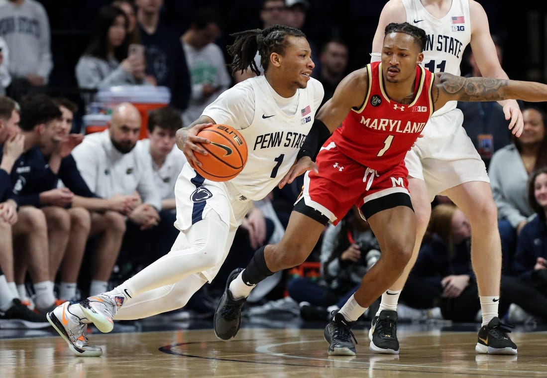 Mar 10, 2024; University Park, Pennsylvania, USA; Penn State Nittany Lions guard Ace Baldwin Jr (1) dribbles the ball toward the basket as Maryland Terrapins guard Jahmir Young (1) defends during the second half at Bryce Jordan Center. Penn State defeated Maryland 85-69. Mandatory Credit: Matthew O'Haren-USA TODAY Sports