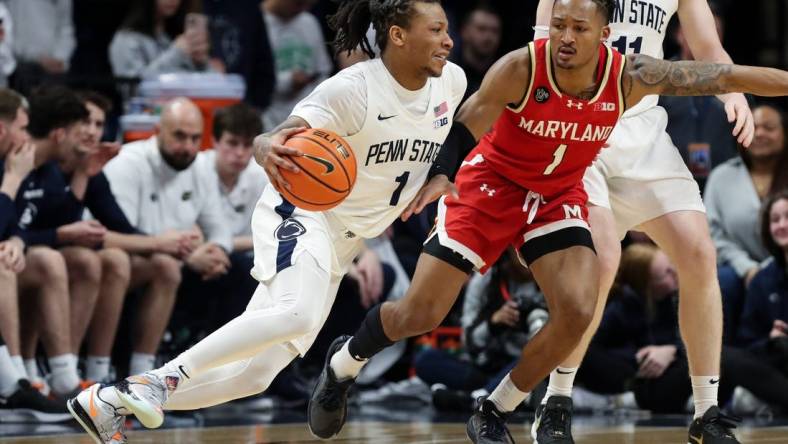 Mar 10, 2024; University Park, Pennsylvania, USA; Penn State Nittany Lions guard Ace Baldwin Jr (1) dribbles the ball toward the basket as Maryland Terrapins guard Jahmir Young (1) defends during the second half at Bryce Jordan Center. Penn State defeated Maryland 85-69. Mandatory Credit: Matthew O'Haren-USA TODAY Sports