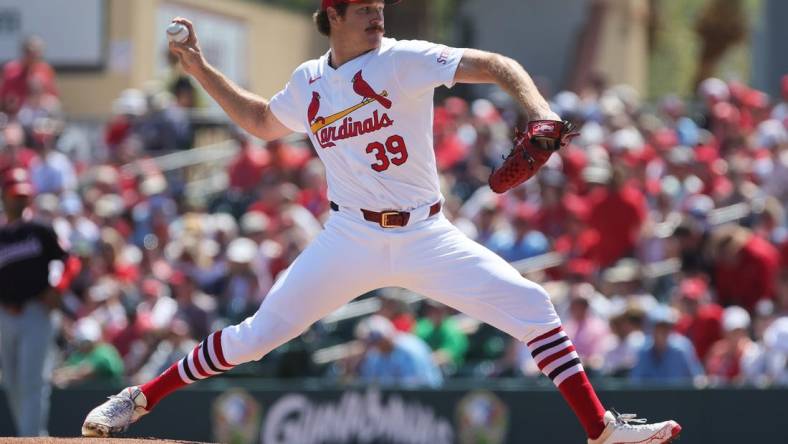 Mar 11, 2024; Jupiter, Florida, USA; St. Louis Cardinals starting pitcher Miles Mikolas (39) delivers a pitch against the Washington Nationals during the first inning at Roger Dean Chevrolet Stadium. Mandatory Credit: Sam Navarro-USA TODAY Sports