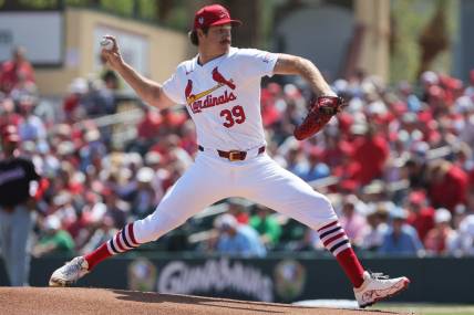Mar 11, 2024; Jupiter, Florida, USA; St. Louis Cardinals starting pitcher Miles Mikolas (39) delivers a pitch against the Washington Nationals during the first inning at Roger Dean Chevrolet Stadium. Mandatory Credit: Sam Navarro-USA TODAY Sports