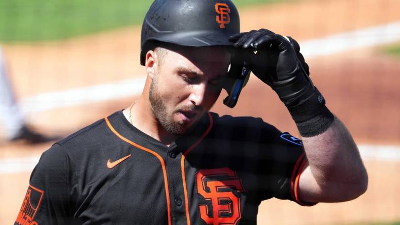 Mar 11, 2024; Surprise, Arizona, USA; San Francisco Giants designated hitter Joey Bart (21) reacts after striking out against the Kansas City Royals during the second inning at Surprise Stadium. Mandatory Credit: Joe Camporeale-USA TODAY Sports