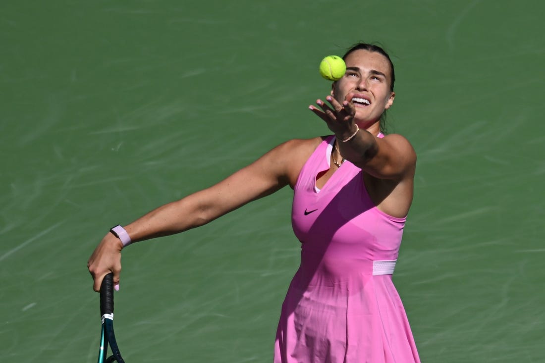 Mar 11, 2024; Indian Wells, CA, USA; Aryna Sabalenka hits a serve in her third round match against Emma Raducanu (GBR) during the BNP Paribas Open at Indian Wells Tennis Garden. Mandatory Credit: Jonathan Hui-USA TODAY Sports