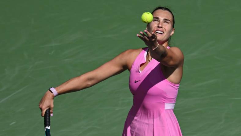 Mar 11, 2024; Indian Wells, CA, USA; Aryna Sabalenka hits a serve in her third round match against Emma Raducanu (GBR) during the BNP Paribas Open at Indian Wells Tennis Garden. Mandatory Credit: Jonathan Hui-USA TODAY Sports