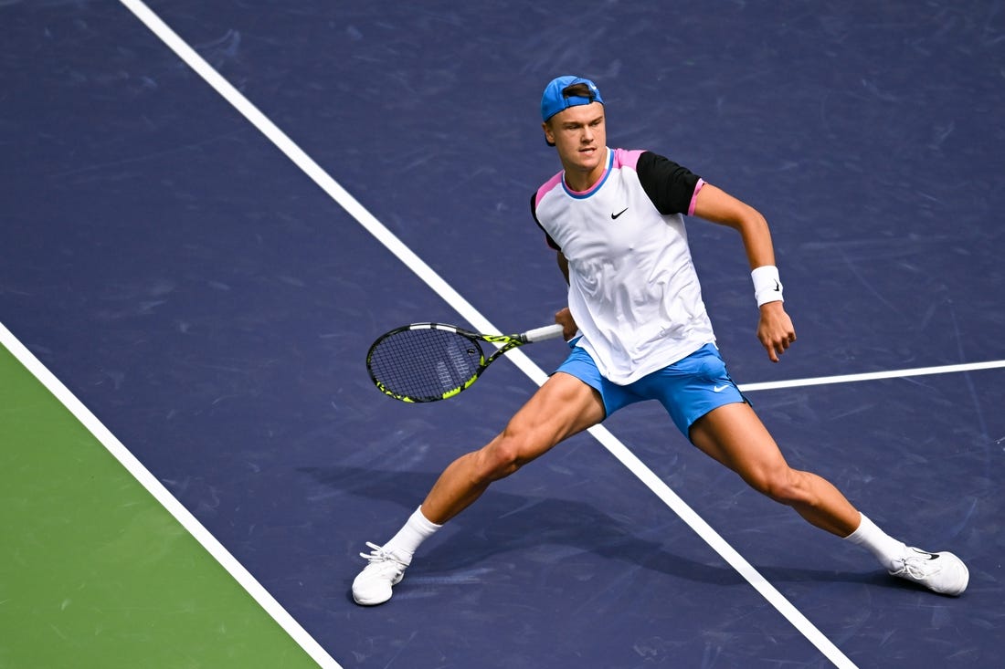 Mar 11, 2024; Indian Wells, CA, USA; Holger Rune (DEN) hits a shot in his third round match against Lorenzo Musetti (ITA) during the BNP Paribas Open at Indian Wells Tennis Garden. Mandatory Credit: Jonathan Hui-USA TODAY Sports