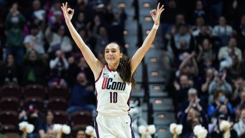 Mar 11, 2024; Uncasville, CT, USA; UConn Huskies guard Nika Muhl (10) reacts after a three point basket against the Georgetown Hoyas in the first half at Mohegan Sun Arena. Mandatory Credit: David Butler II-USA TODAY Sports