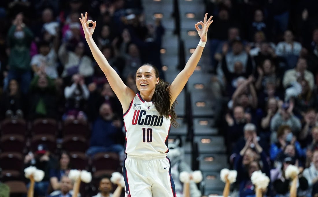 Mar 11, 2024; Uncasville, CT, USA; UConn Huskies guard Nika Muhl (10) reacts after a three point basket against the Georgetown Hoyas in the first half at Mohegan Sun Arena. Mandatory Credit: David Butler II-USA TODAY Sports