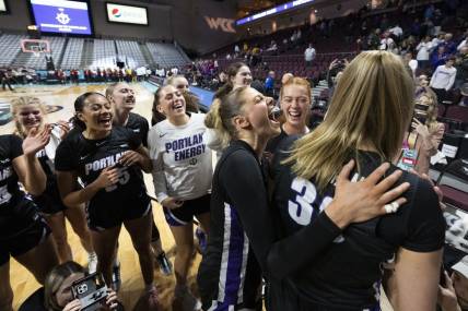 March 11, 2024; Las Vegas, NV, USA; Portland Pilots forward Kennedy Dickie (12) celebrates with forward Lucy Cochrane (30) against the Santa Clara Broncos after the game in the semifinals of the WCC Basketball Championship at Orleans Arena. Mandatory Credit: Kyle Terada-USA TODAY Sports