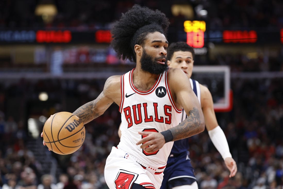 Mar 11, 2024; Chicago, Illinois, USA; Chicago Bulls guard Coby White (0) drives to the basket against the Dallas Mavericks during the first half at United Center. Mandatory Credit: Kamil Krzaczynski-USA TODAY Sports