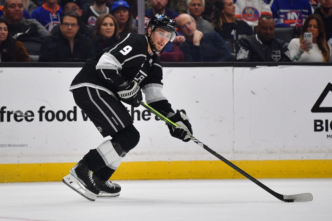 Mar 11, 2024; Los Angeles, California, USA; Los Angeles Kings right wing Adrian Kempe (9) controls the puck against the New York Islanders during the second period at Crypto.com Arena. Mandatory Credit: Gary A. Vasquez-USA TODAY Sports