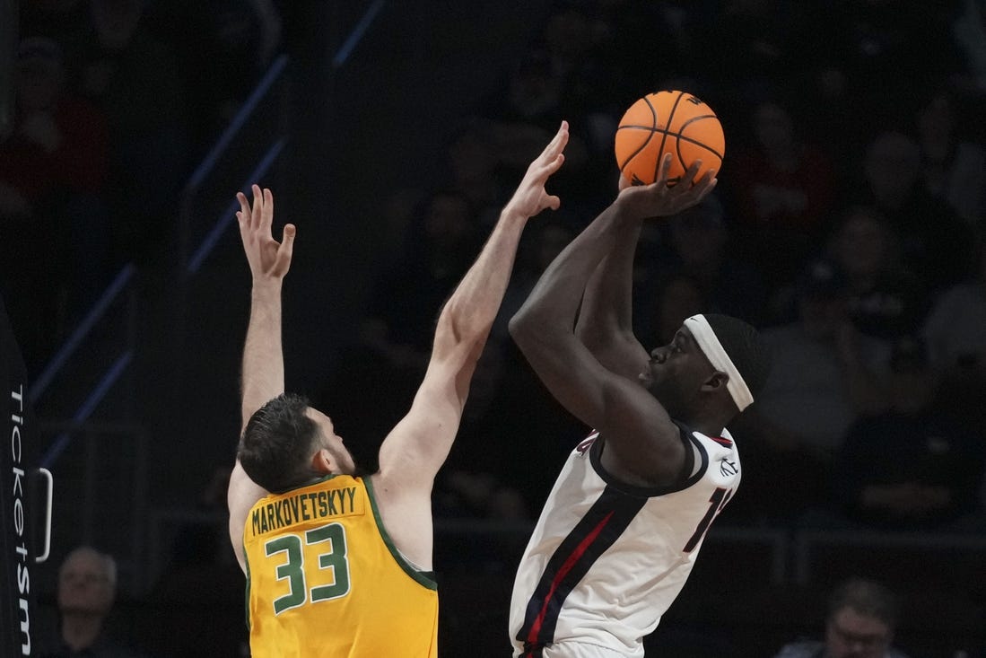 March 11, 2024; Las Vegas, NV, USA; Gonzaga Bulldogs forward Graham Ike (13) shoots the basketball against San Francisco Dons center Volodymyr Markovetskyy (33) during the first half in the semifinals of the WCC Basketball Championship at Orleans Arena. Mandatory Credit: Kyle Terada-USA TODAY Sports