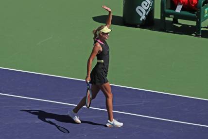 Anastasia Potapova waves to the crowd after her fourth round win against Jasmine Paolini at the BNP Paribas Open in Indian Wells, Calif., on Tues., March 12, 2024.
