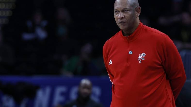 Mar 12, 2024; Washington, D.C., USA; Louisville Cardinals head coach Kenny Payne looks on from the bench against the North Carolina State Wolfpack in the second half at Capital One Arena. Mandatory Credit: Geoff Burke-USA TODAY Sports