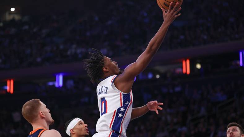 Mar 12, 2024; New York, New York, USA; Philadelphia 76ers guard Tyrese Maxey (0) shoots the ball against the New York Knicks New York Knicks guard Donte DiVincenzo (0) during the first quarter at Madison Square Garden. Mandatory Credit: Vincent Carchietta-USA TODAY Sports