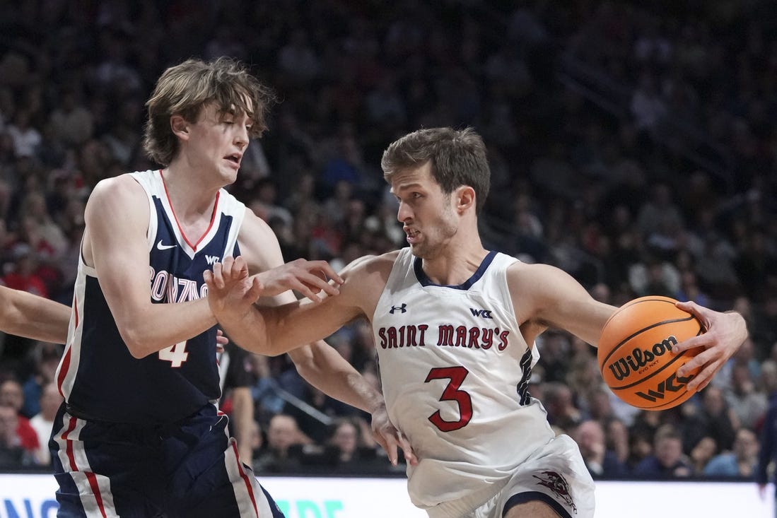 March 12, 2024; Las Vegas, NV, USA; Saint Mary's Gaels guard Augustas Marciulionis (3) dribbles the basketball against Gonzaga Bulldogs guard Dusty Stromer (4) during the first half in the finals of the WCC Basketball Championship at Orleans Arena. Mandatory Credit: Kyle Terada-USA TODAY Sports