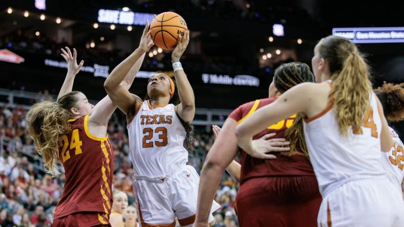 Mar 12, 2024; Kansas City, MO, USA; Texas Longhorns forward Aaliyah Moore (23) shoots the ball over Iowa State Cyclones forward Addy Brown (24) during the first half at T-Mobile Center. Mandatory Credit: William Purnell-USA TODAY Sports