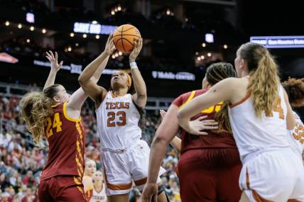 Mar 12, 2024; Kansas City, MO, USA; Texas Longhorns forward Aaliyah Moore (23) shoots the ball over Iowa State Cyclones forward Addy Brown (24) during the first half at T-Mobile Center. Mandatory Credit: William Purnell-USA TODAY Sports