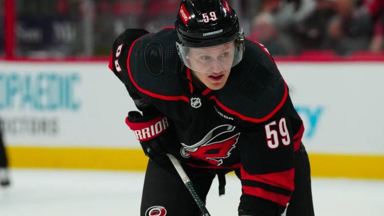 Mar 12, 2024; Raleigh, North Carolina, USA; Carolina Hurricanes left wing Jake Guentzel (59) looks on against the New York Rangers during the third period at PNC Arena. Mandatory Credit: James Guillory-USA TODAY Sports